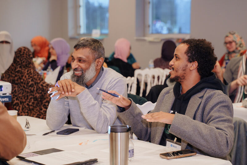 Leaders talking at retreat